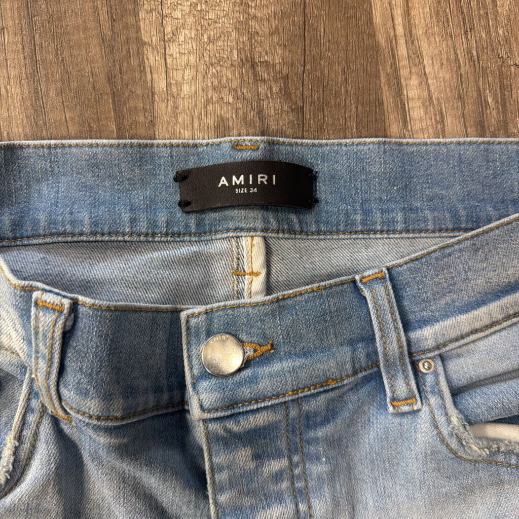 Amiri jean MA Logo Blue Paint splatter