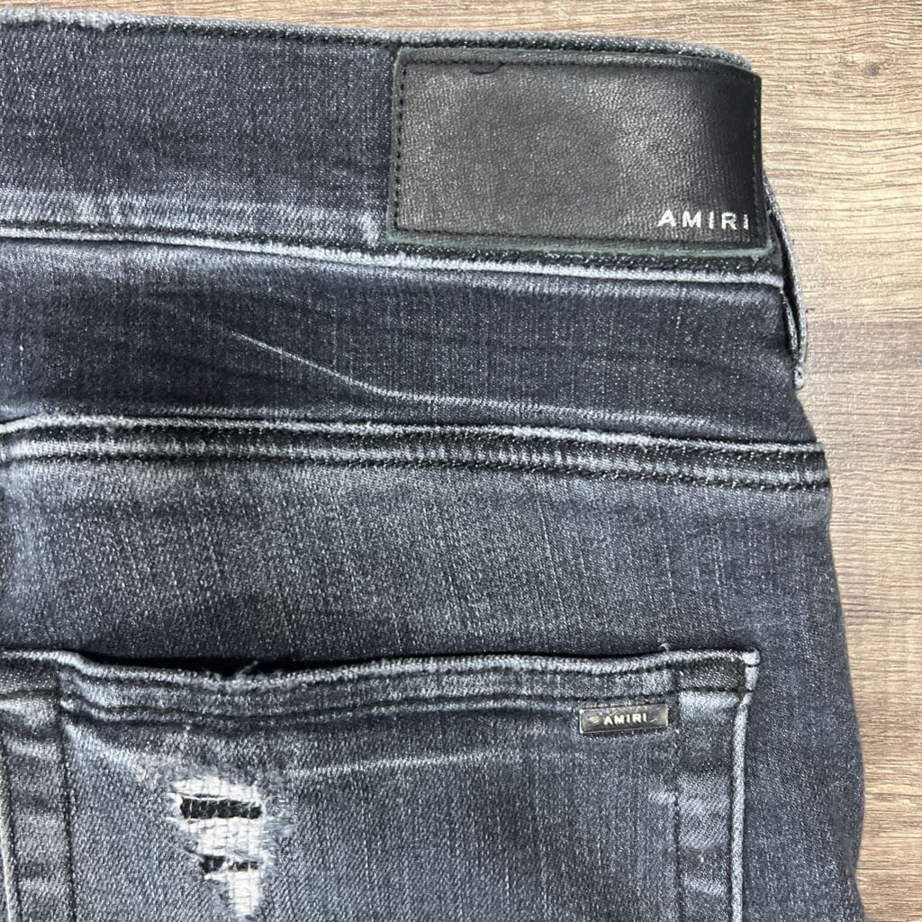 Amiri jean grey black oblique logo