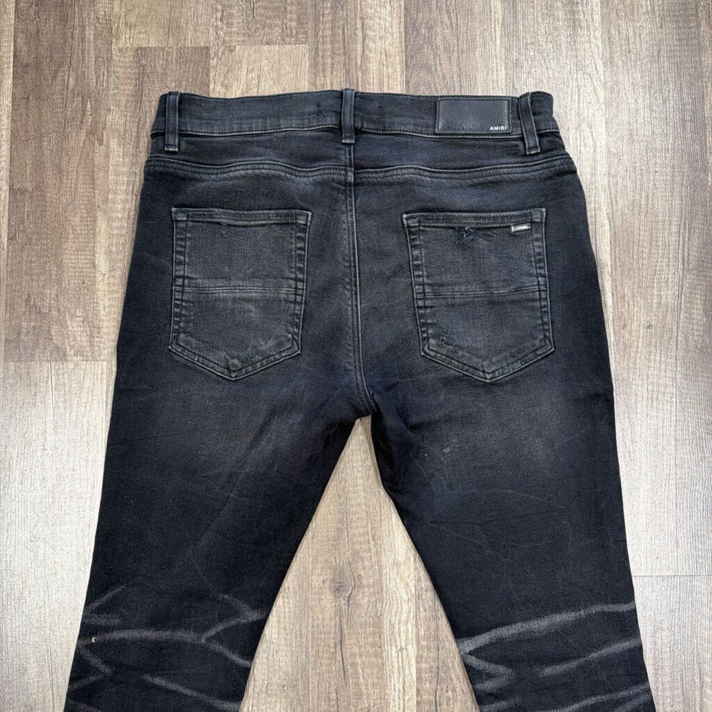 Amiri Jean Black Ripped Knee