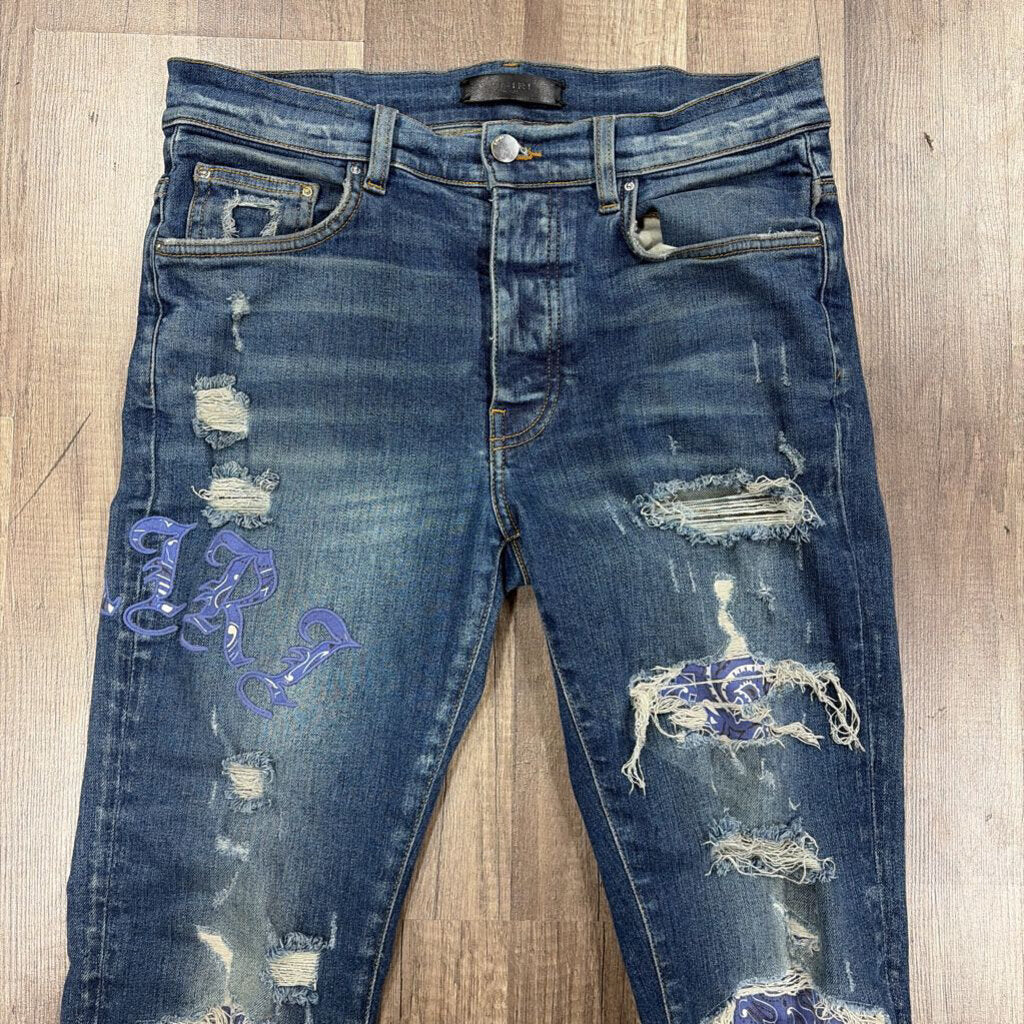 Amiri Jean Old English Oblique Logo