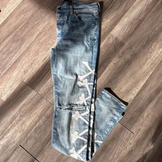 Amiri jean blue white cross bone