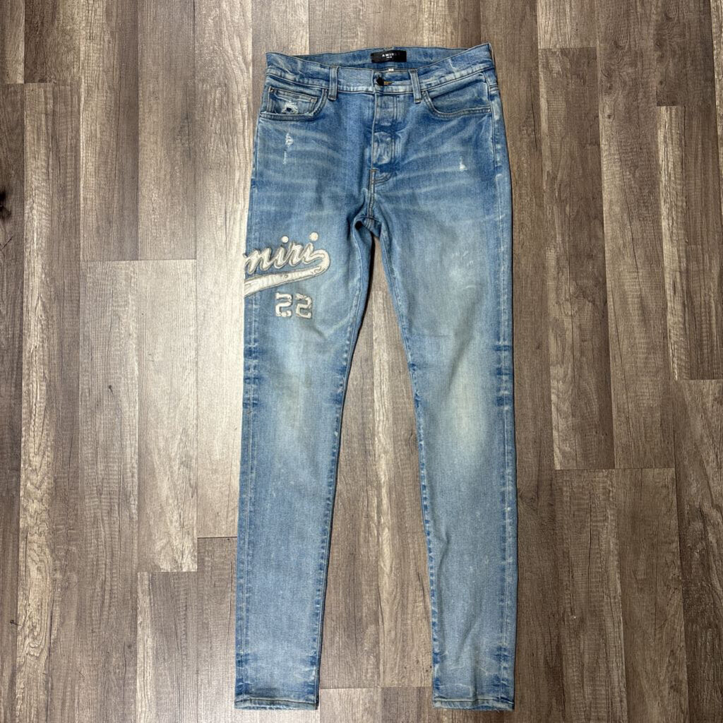 Amiri Jean White Varsity Logo