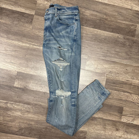 Amiri Jean Blue Ripped Knee