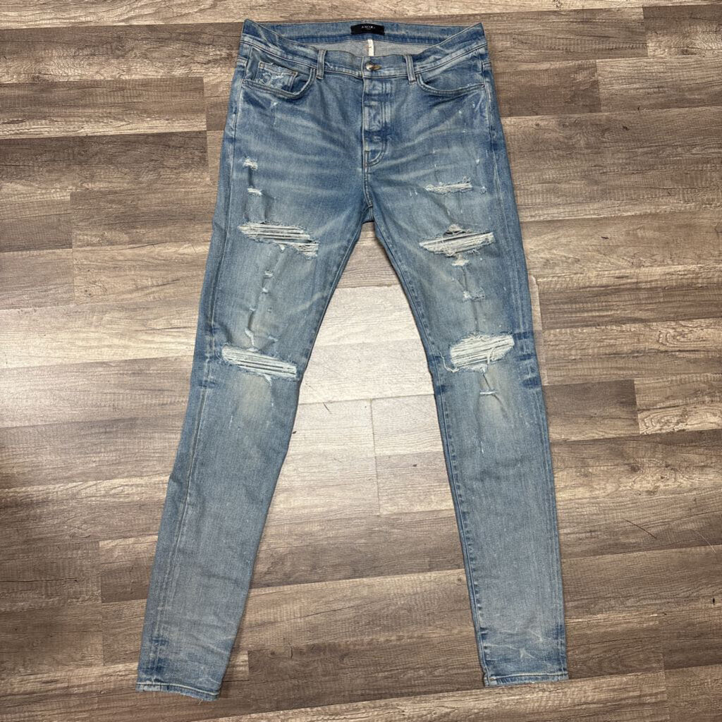 Amiri Jean Blue Ripped Knee