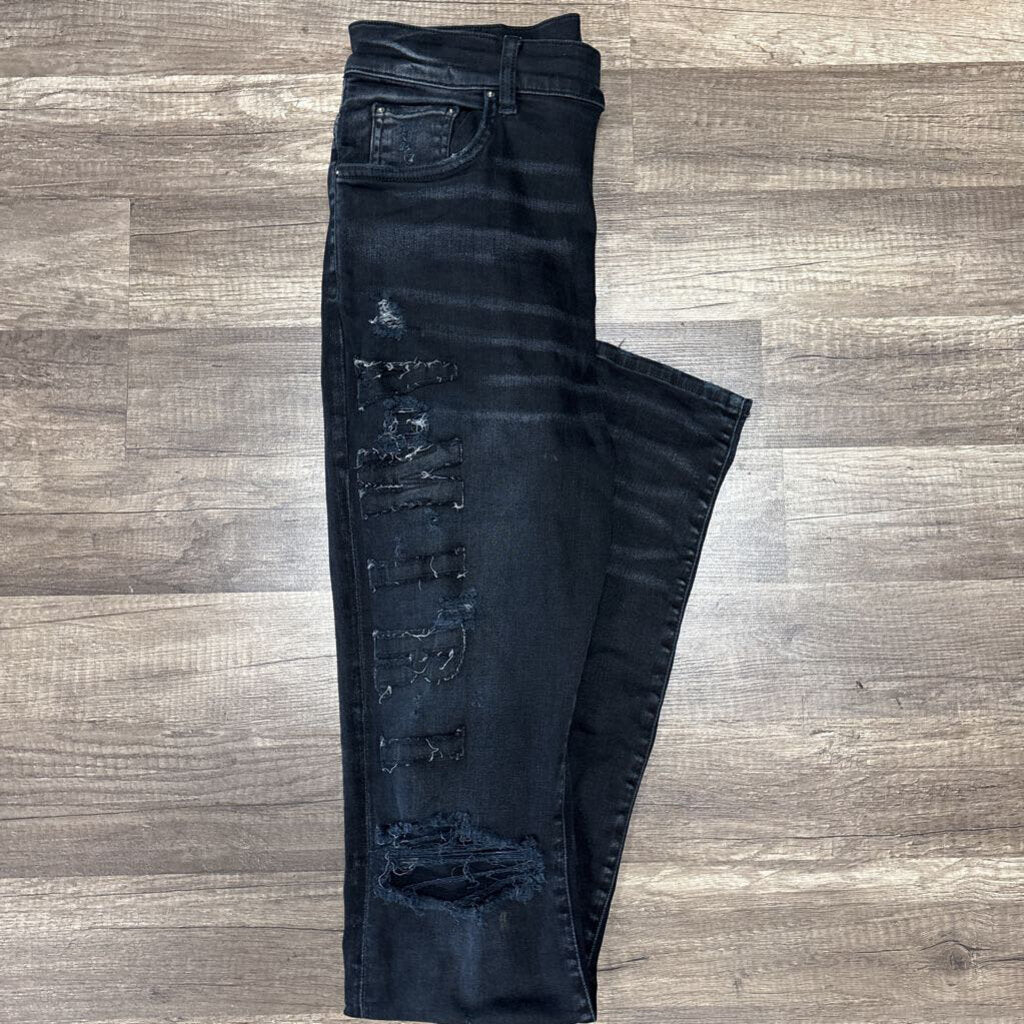Amiri jean distressed oblique logo black