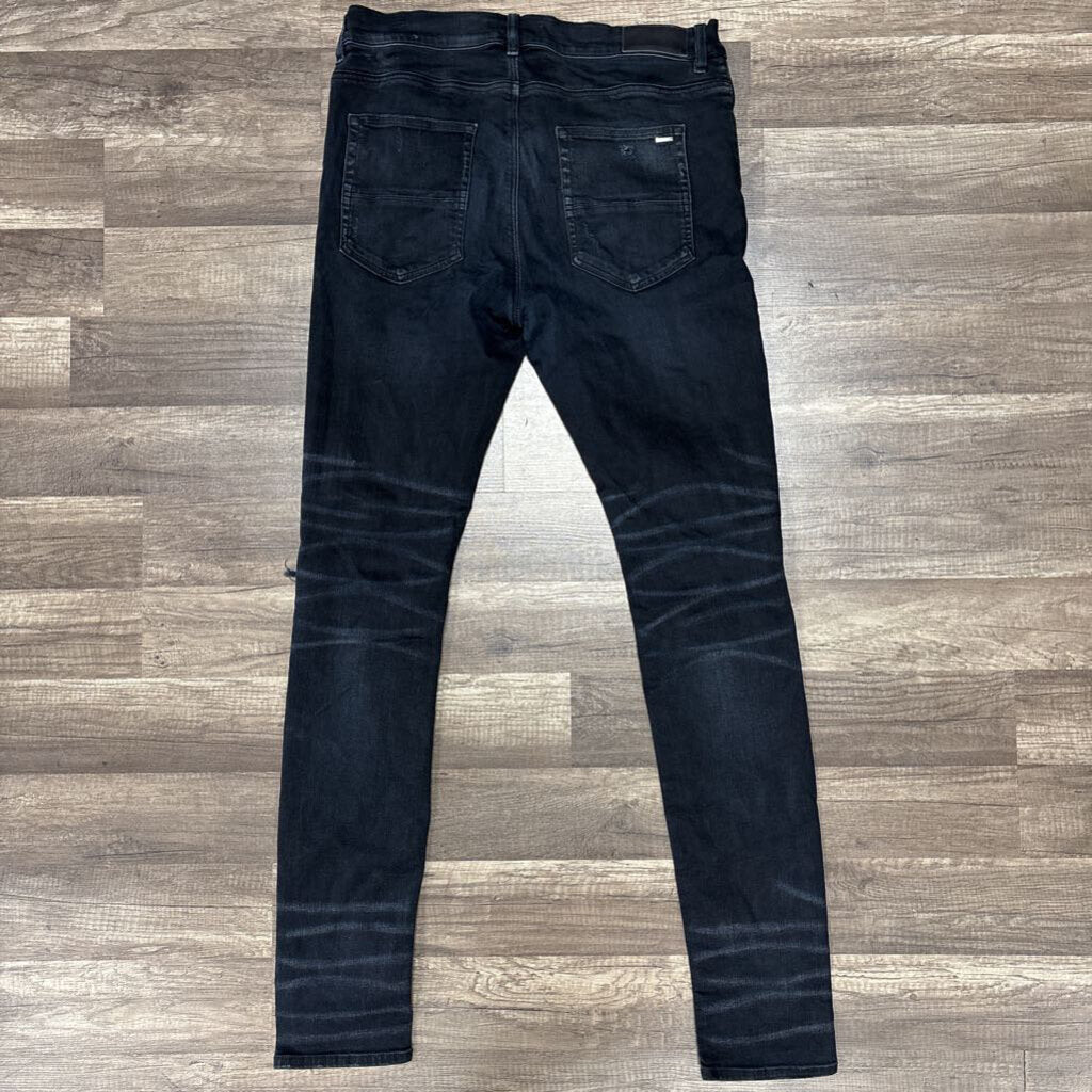 Amiri jean distressed oblique logo black
