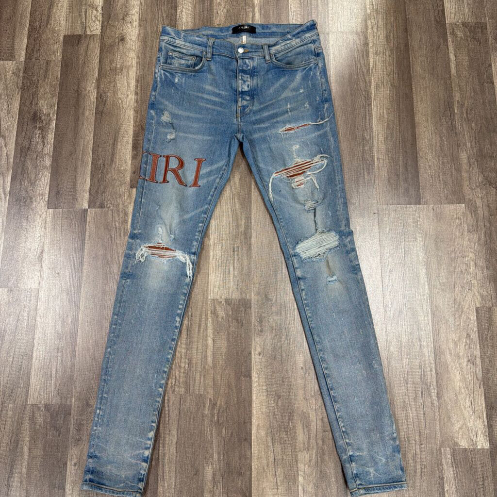 Amiri Jean Brown Leather oblique Logo