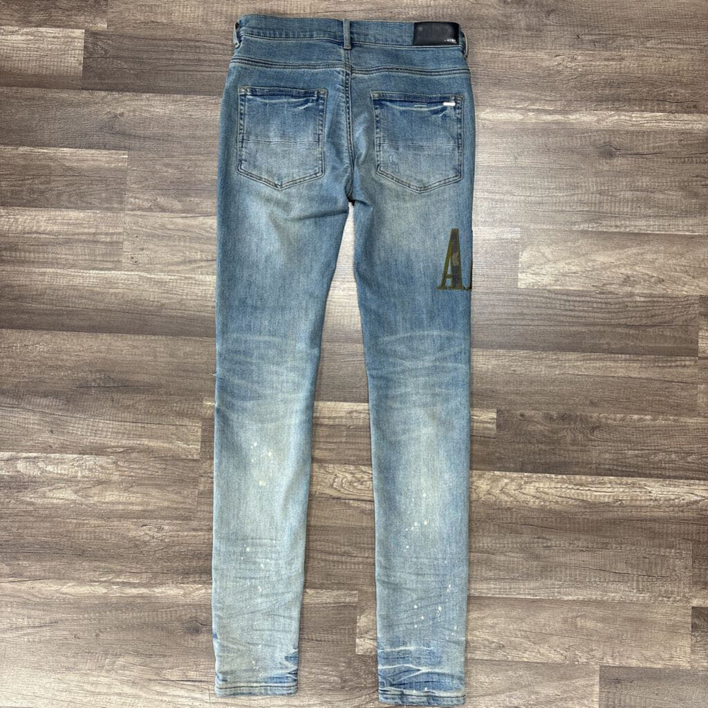 Amiri Jean Camo Oblique Logo