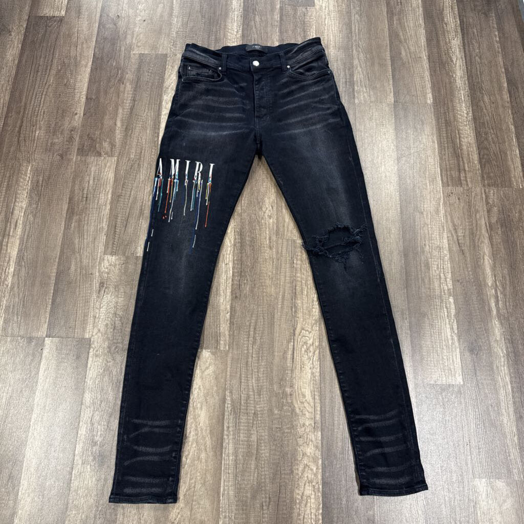 Amiri Jean Drip Logo