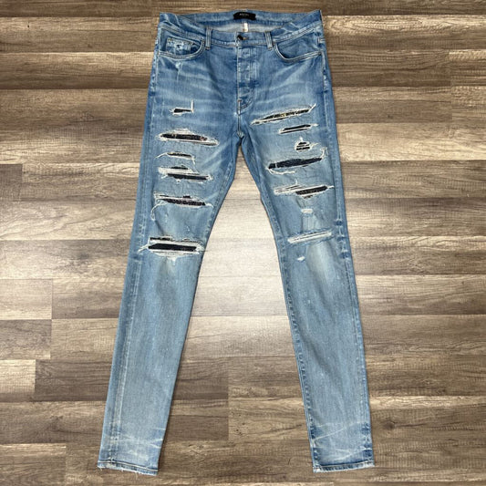 Amiri jean blue multicolor thrasher patch