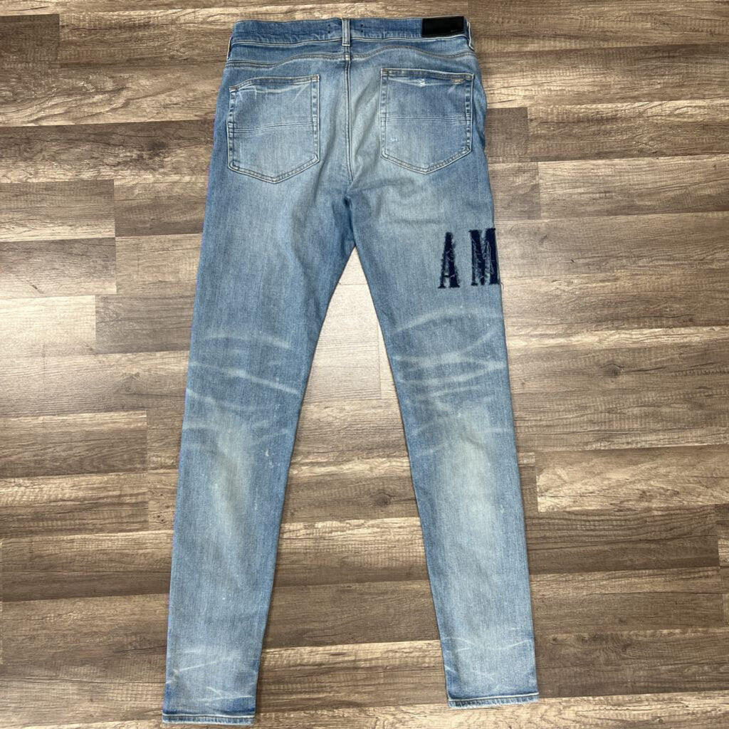 Amiri jean mx 1 blue patch oblique logo
