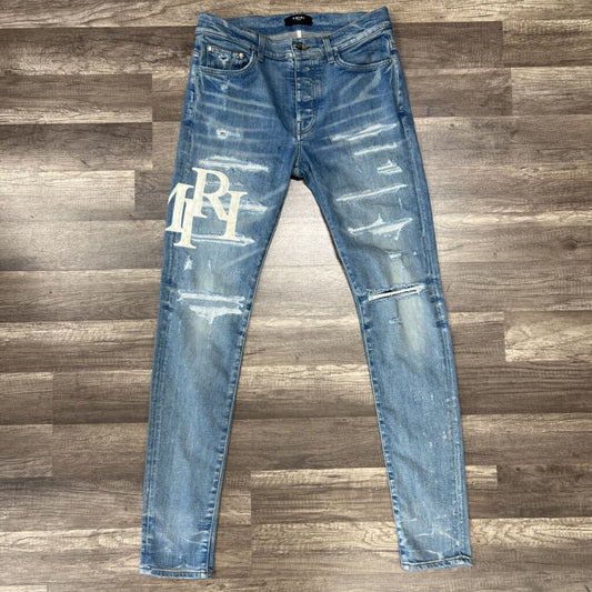 Amiri jean blue oblique white logo distressed