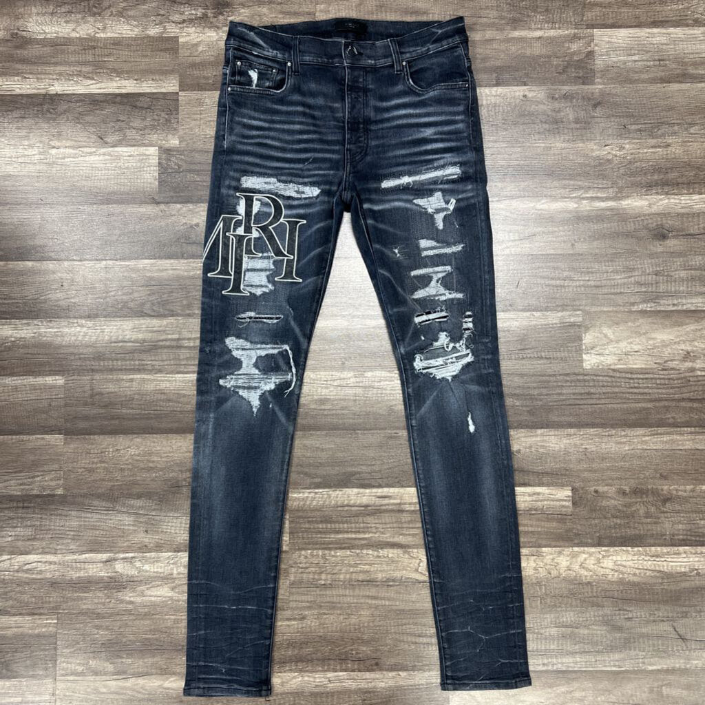 Amiri jean grey black oblique logo