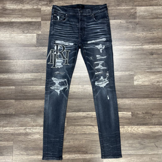 Amiri jean grey black oblique logo