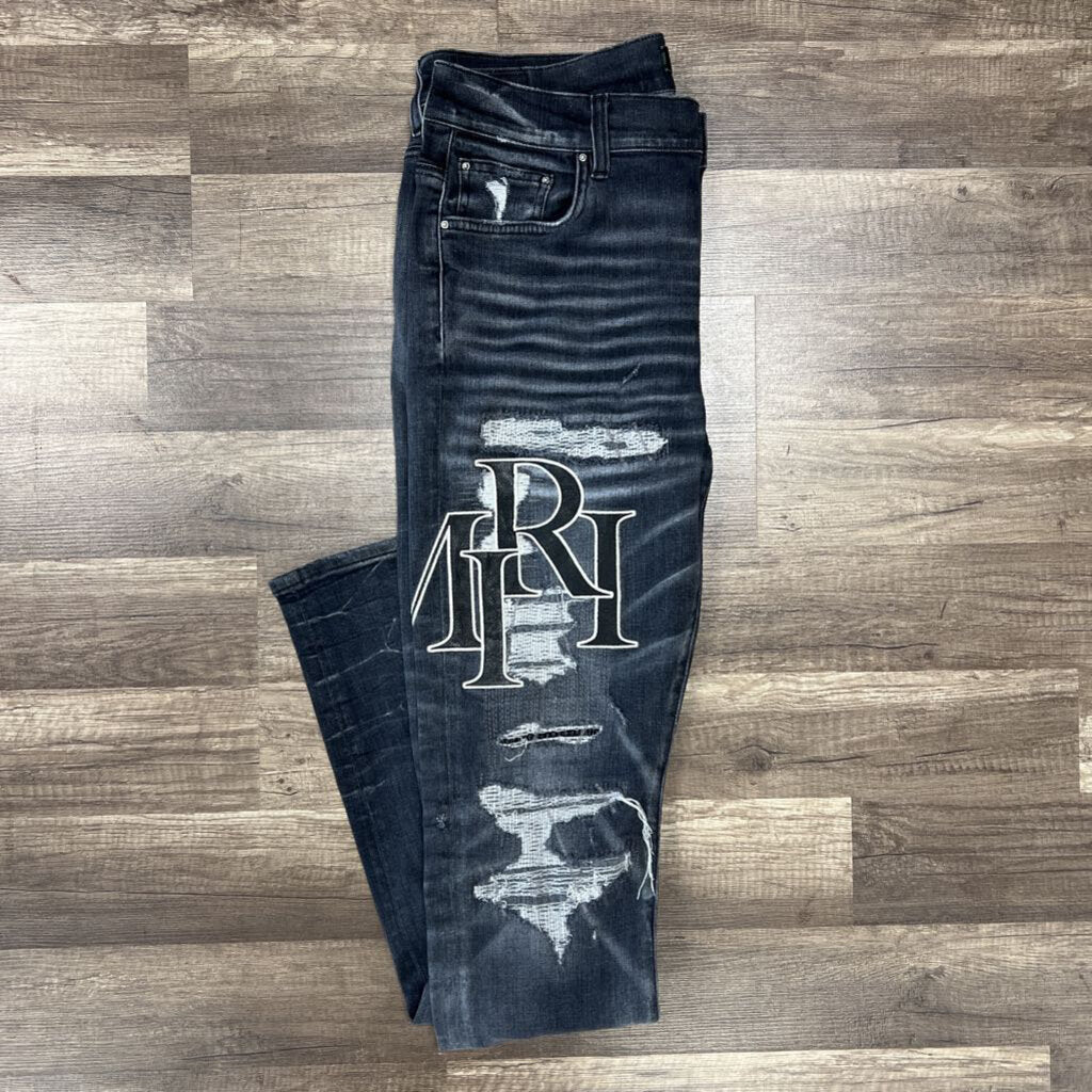 Amiri jean grey black oblique logo