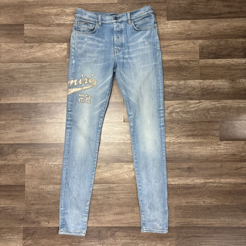 Amiri Jean white oblique logo