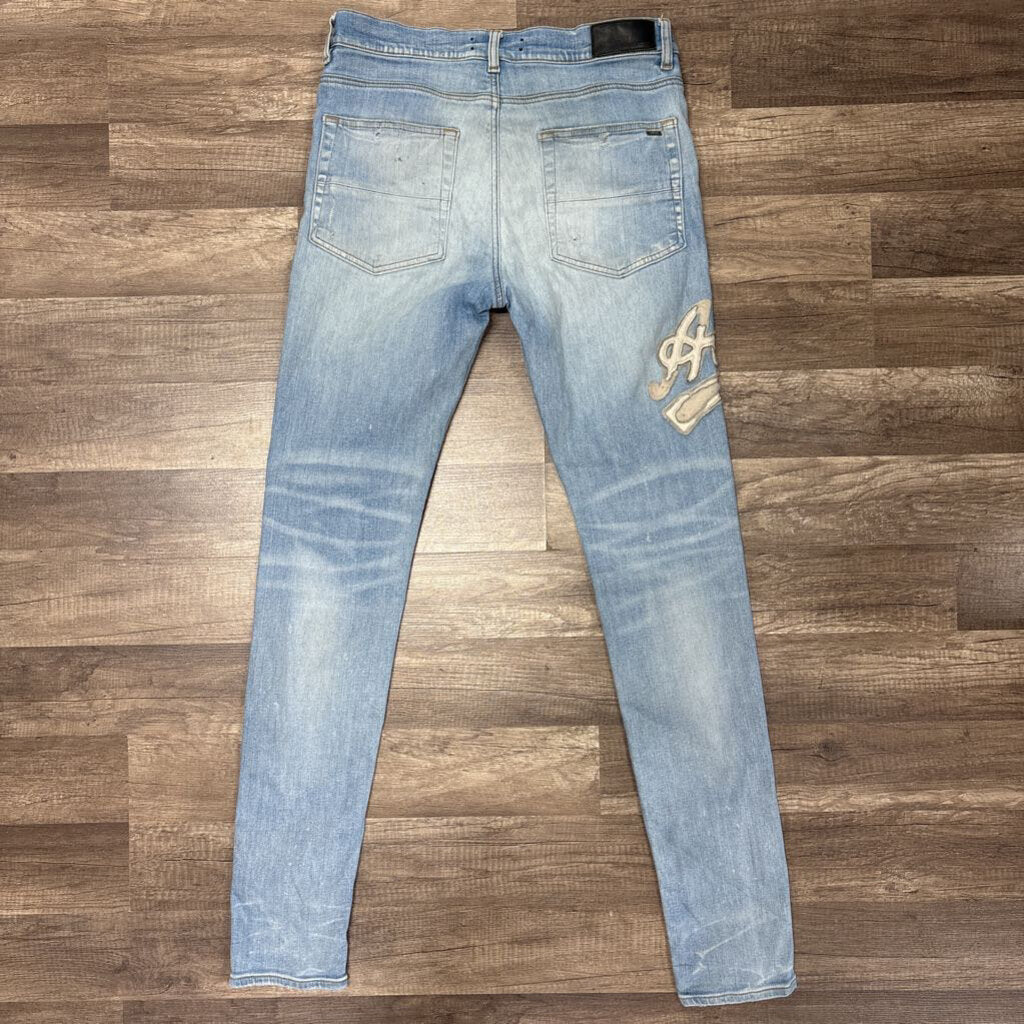 Amiri Jean white oblique logo