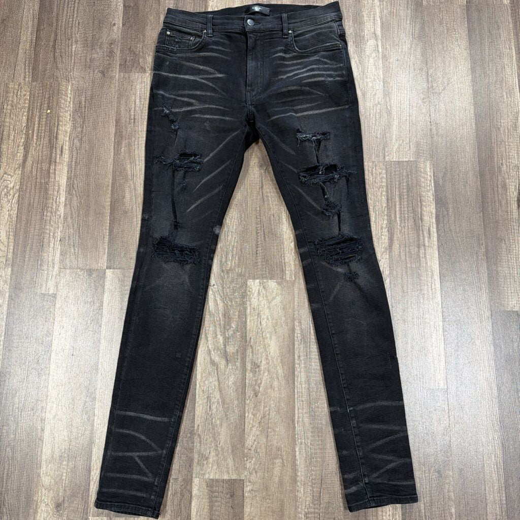 Amiri Jean Black Ripped Knee