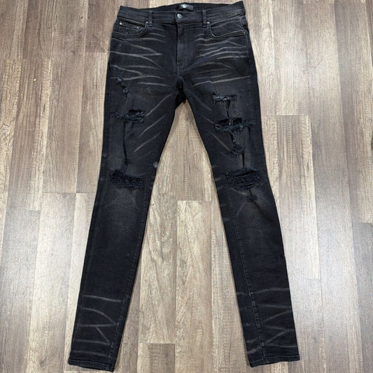 Amiri Jean Black Ripped Knee