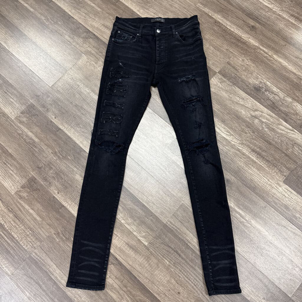 Amiri Jean Trasher Oblique Logo
