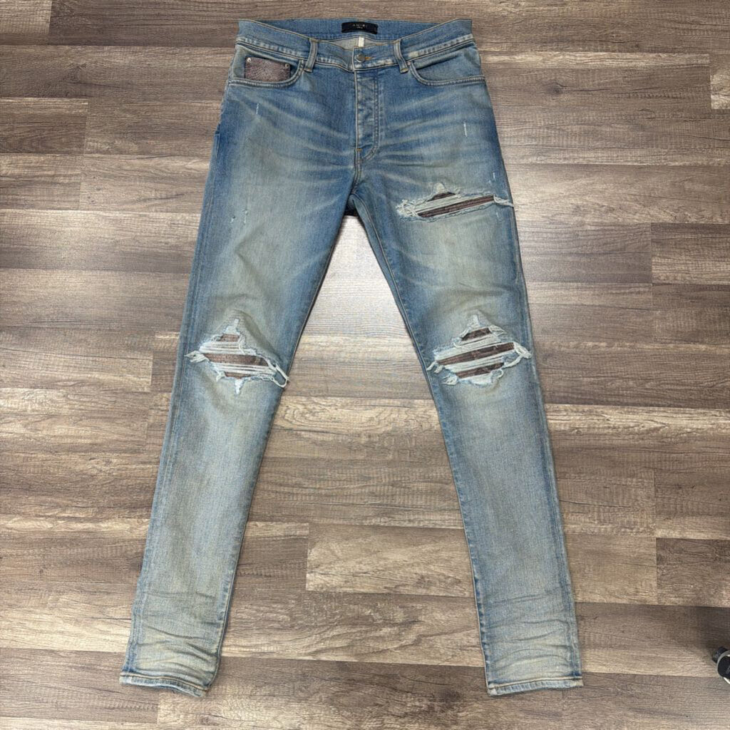 Amiri Jean Mx1 purple snakeskin