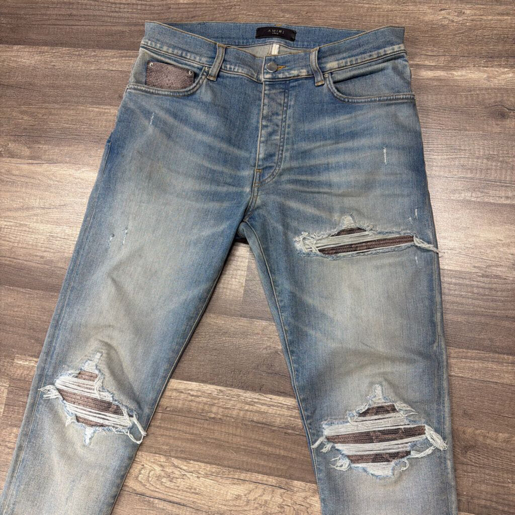 Amiri Jean Mx1 purple snakeskin