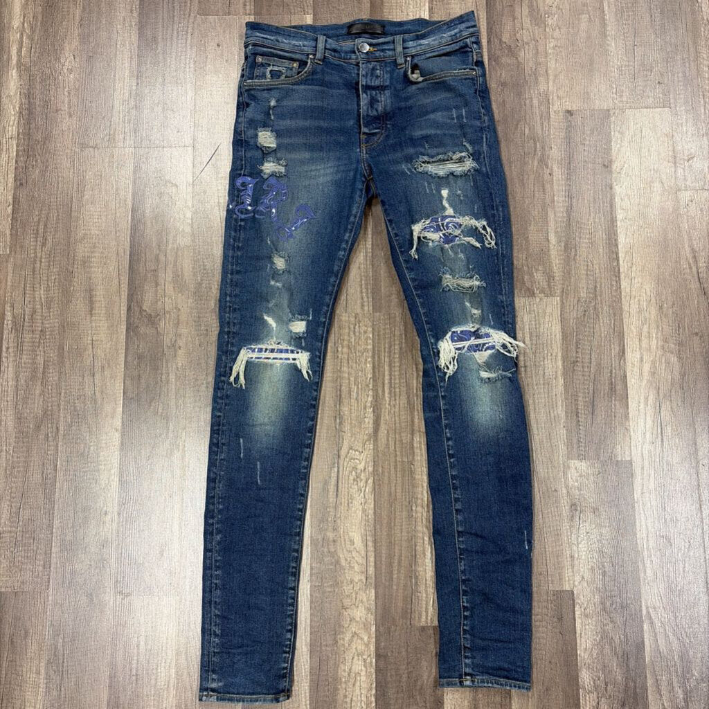 Amiri Jean Old English Oblique Logo